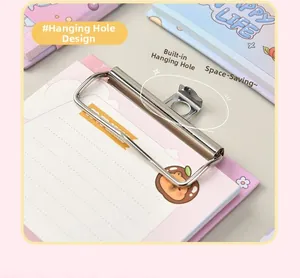 Close-up of A6 clipboard memo pad with pink cartoon bear design and metal hanging clip