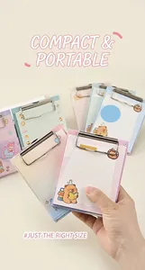 Detail of A6 mini clipboard notepad with cartoon bear design and metal clip for journaling