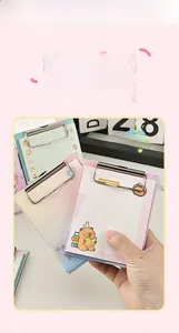 Detail of A6 mini clipboard notepad with cartoon bear design and metal clip for journaling