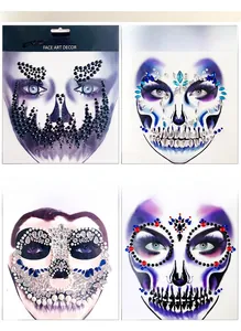 Detail view of four Halloween face art decor rhinestone stickers with skull patterns