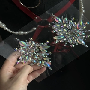 Sparkling iridescent star-shaped rhinestone body jewels for EDM festivals and party makeup