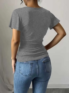 Slim fit gray V-neck T-shirt with waist pleats shown from the back on a model