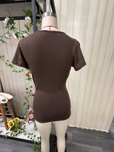 Detail view showing the back side of a slim fit brown V-neck cotton blend short sleeve T-shirt