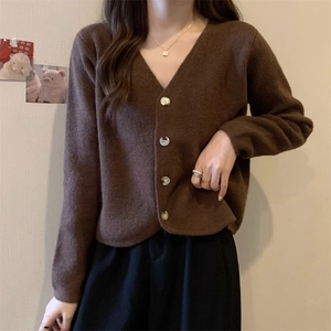 Minimalist brown V-neck knit cardigan with long sleeves and light-colored buttons for women