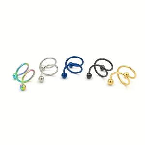 Détail montrant cinq couleurs d'anneaux spirale en acier inoxydable avec boules