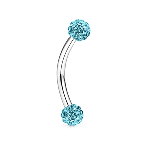Macro detail of curved stainless steel piercing bar with light blue crystal paved balls