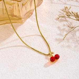 Charming red cherry pendant necklace with gold chain and sparkling crystal leaf accents