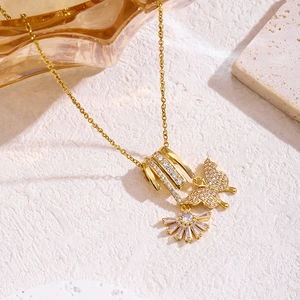 Elegant gold titanium steel necklace with zircon butterfly pendant on white stone