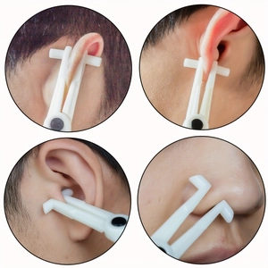White plastic body piercing clamps for ear, nose, and cartilage procedures in four-view display