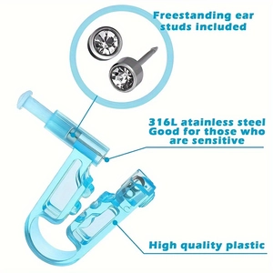 Detailed view of blue ear piercing gun with 316L stainless steel stud and clear zircon