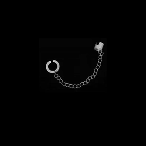 Detail of silver stainless steel earring featuring a punk style hoop with a long link chain