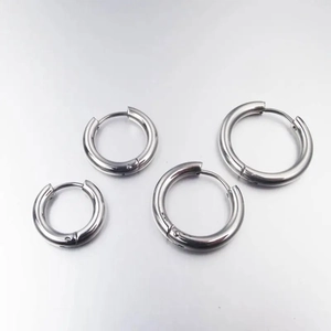 Detail showing four sizes of 4mm thick silver stainless steel hoop earrings in a set