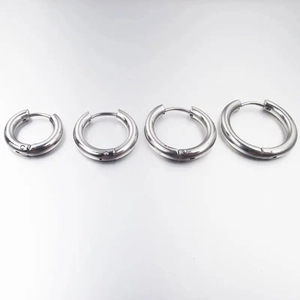Set of four polished stainless steel hoop earrings in various sizes for women and men