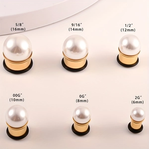 Golden stainless steel ear gauges with white pearls in various sizes from 6mm to 16mm