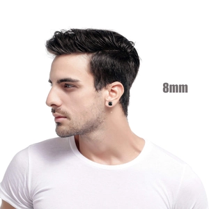 Close-up of 8mm square black zircon stud earring with claw setting on male model ear