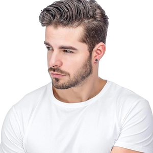 Close-up of a polished black round stud earring worn by a male model for scale