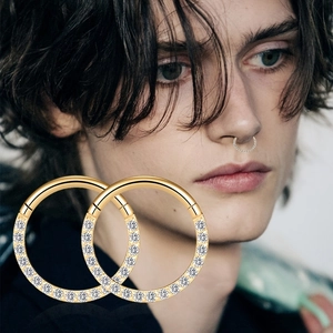 316L gold stainless steel septum nose ring featuring a row of shimmering cubic zirconia