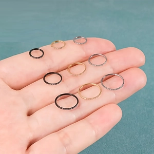 Aros de nariz de acero 316L con circonitas en acabados dorado, negro y plateado