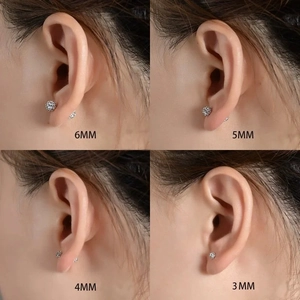 Close-up comparison of four sizes (3mm to 6mm) of crystal disco ball stud earrings on model