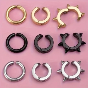 Set de pendientes de clip de acero inoxidable en oro, negro y plata con diseño de remaches