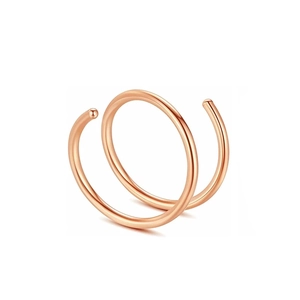 Macro view of double layer rose gold stainless steel spiral nose ring with polished finish