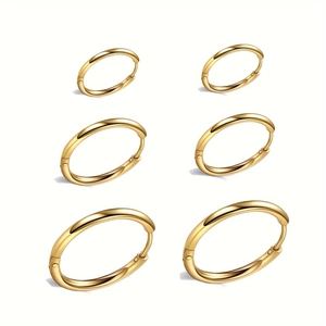 Set of 3 pairs of polished gold stainless steel hoop earrings in varying sizes