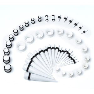 Comprehensive black and white acrylic ear stretching kit with tapers and plugs in various sizes