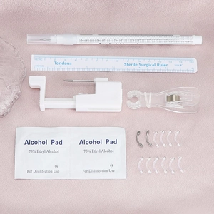 Kit completo per piercing professionale con pistola, righello, pennarelli e 12 gioielli