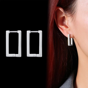 Minimalist silver rectangle geometric hoop earrings shown on model and in close-up shot