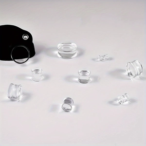 Clear acrylic double flared ear gauges in multiple sizes with smooth polished finish