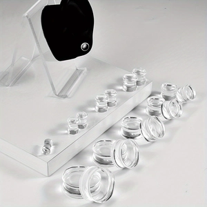 Detailed set of clear acrylic double flare ear tunnels in various gauge sizes