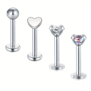 Set of four stainless steel lip studs with heart designs and clear zircon gemstones