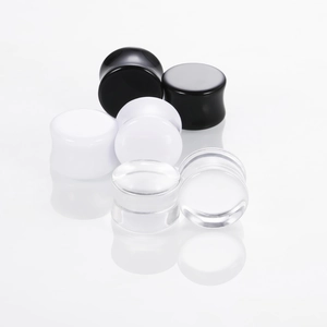 Classic acrylic ear plugs set in black, white, and clear for body piercing jewelry