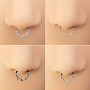 Macro detail of 316L stainless steel horseshoe nose rings with cubic zirconia inlay