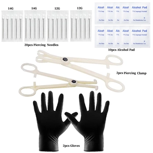 Detail view of body piercing kit with sterile needles, forceps, and black protective gloves