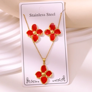 Detailed macro view of 304 stainless steel red four-leaf flower necklace and earring set
