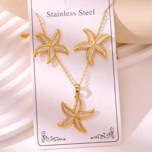 Detailed macro view of the starfish necklace and earrings set in gold stainless steel