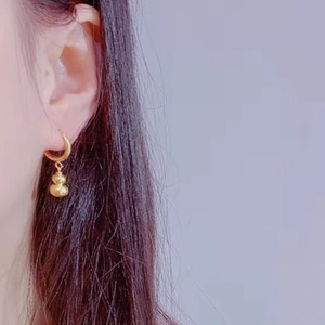 Boucles d'oreilles créoles dorées en acier inoxydable avec pendentif calebasse