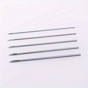 Macro detail of five assorted sizes of sterile stainless steel body piercing needles
