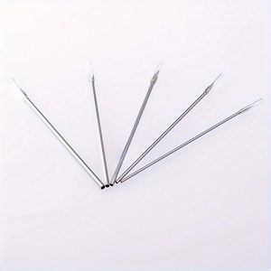 Detailed close-up of 5-piece stainless steel piercing needles with protective caps