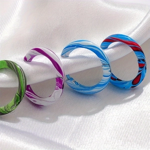 Colorful marble pattern acrylic spiral rings in green, purple, blue, and red tones