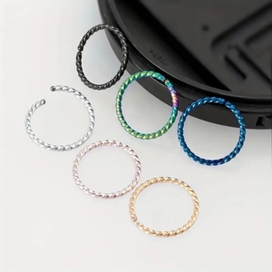 Set of 6 twisted stainless steel nose rings in silver, black, gold, and multi-color