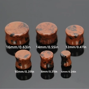 Double flared stone ear plugs set in polished reddish-brown mahogany obsidian pattern