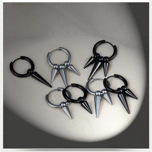 Punk style stainless steel hoop earrings with cone charms in black and silver finishes