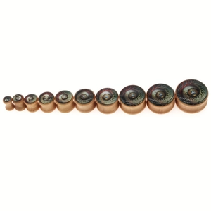 Detail view of eleven wooden ear plugs in varying sizes with colorful owl eye patterns