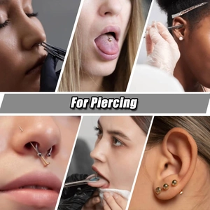 Detail view of acrylic piercing tools kit including sterile forceps and jewelry pieces