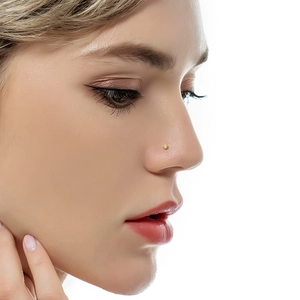 Close-up of a minimalist tiny gold nose stud with floral design on a model nose wing