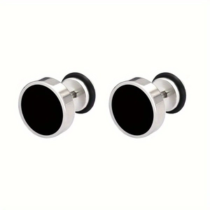 Detail of round stainless steel stud earrings featuring a flat black enamel finish