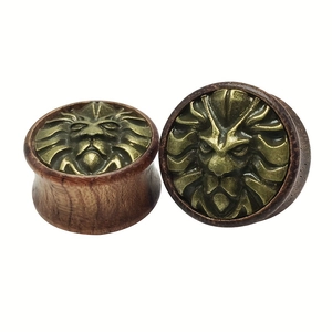 Retro lion head wood ear gauges with vintage brass finish on a clean white background
