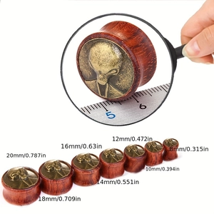 Alien head engraved wooden ear gauges and plugs set in various sizes for ear piercings